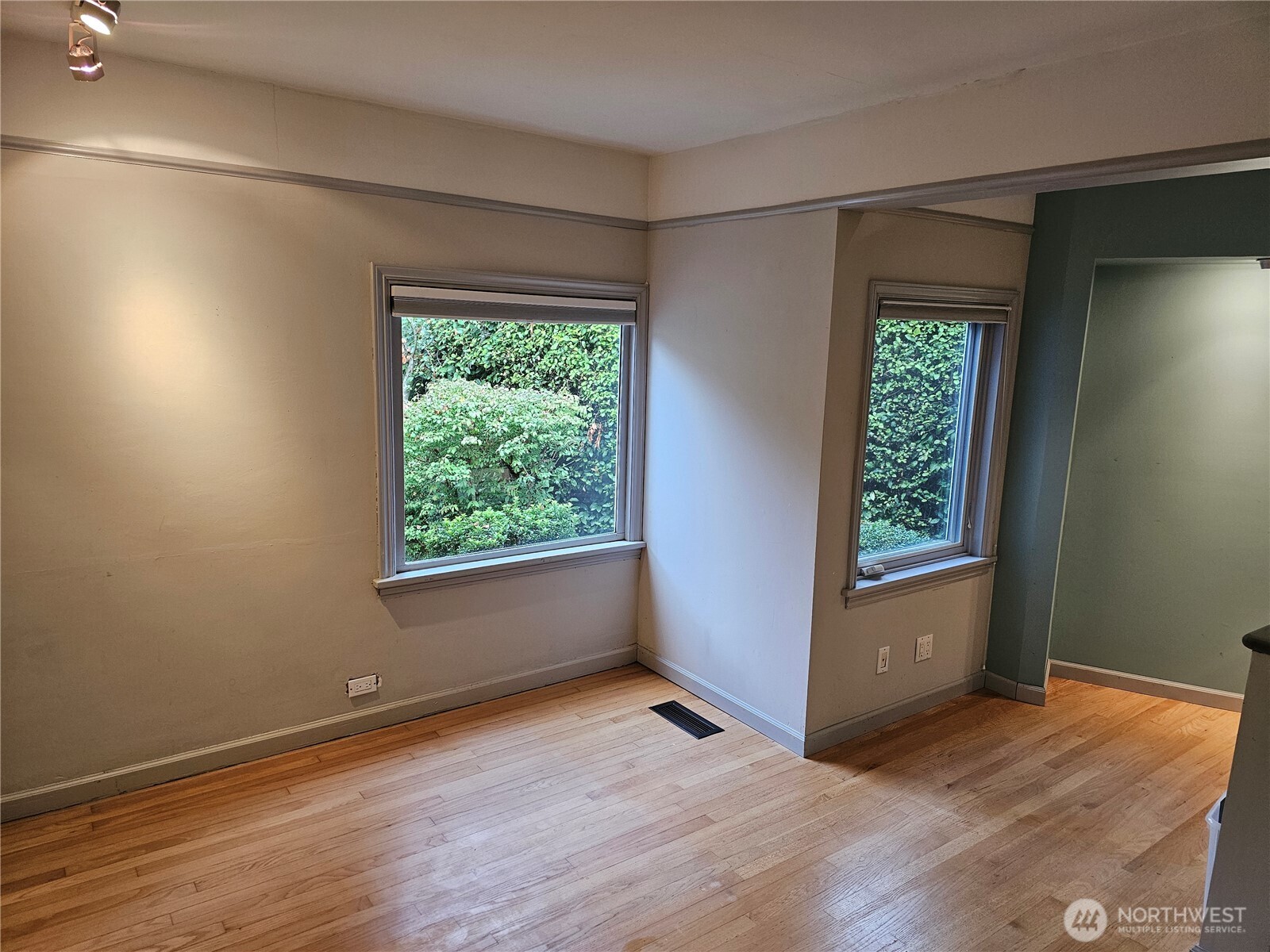 2822 Prosch Avenue West Seattle, WA 98119 - Photo 20 of 31 an empty room with wooden floor and windows