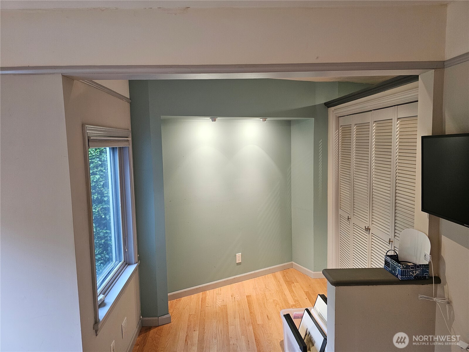 2822 Prosch Avenue West Seattle, WA 98119 - Photo 21 of 31 a bedroom with a bed and a flat tv screen