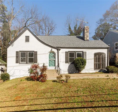 a front view of house with yard outdoor seating