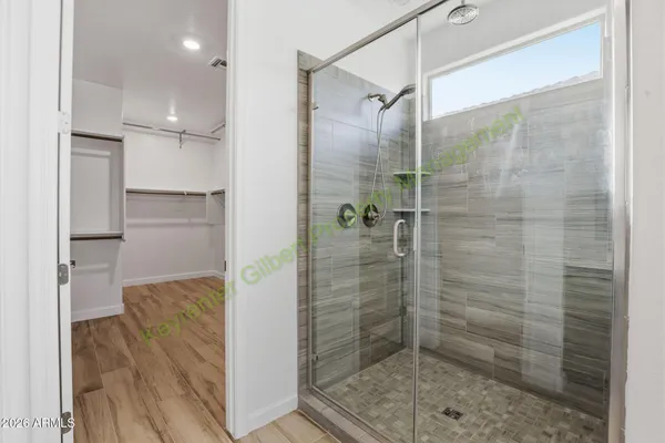 a bathroom with a double vanity sink and mirror