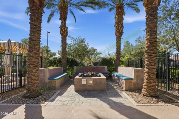 a swimming pool with outdoor seating and yard