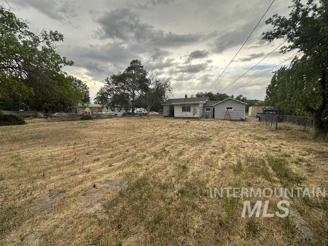 1301 Ridge Street Pocatello, ID 83201 - Photo 5 of 12 Expansive lot featuring a single-story residence with gray siding and a light-colored roof