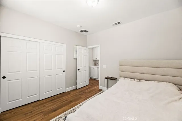 a bedroom with bed and a window