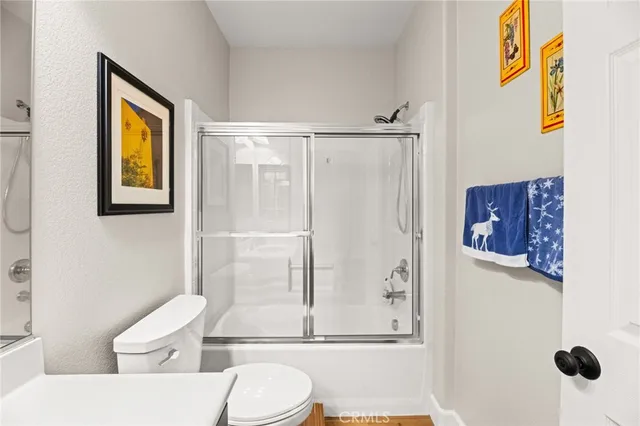 a kitchen with a stove and white cabinets