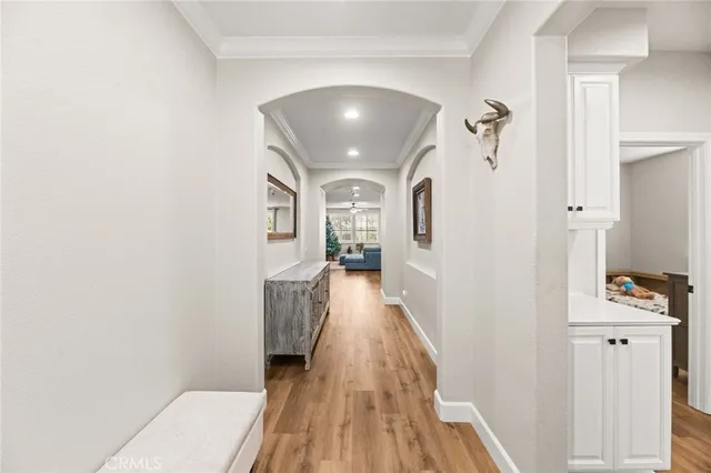 a kitchen with a dining table chairs refrigerator and cabinets