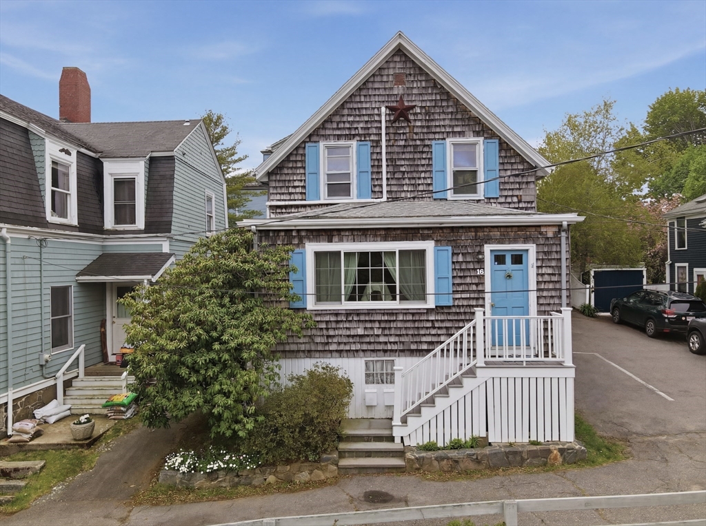 16 Evans Road, Unit 2 Marblehead, MA 01945 - Photo 15 of 24 a front view of a house with a yard