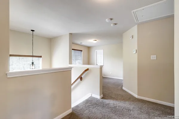 a view of a kitchen with a sink and a window
