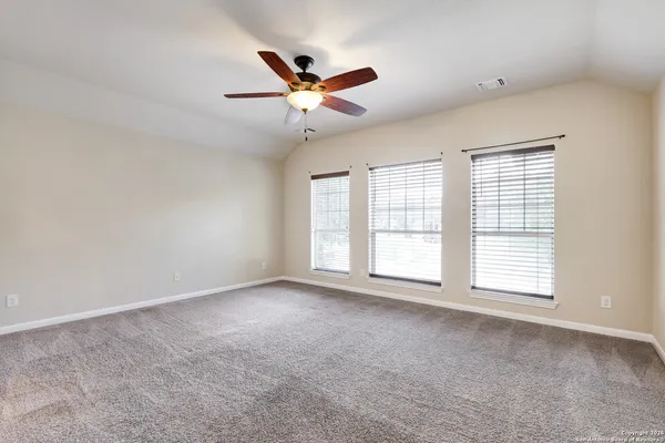 a view of an empty room with a window