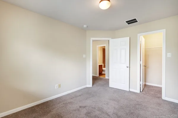 a view of an empty room and window
