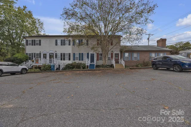 a car parked in front of a brick house