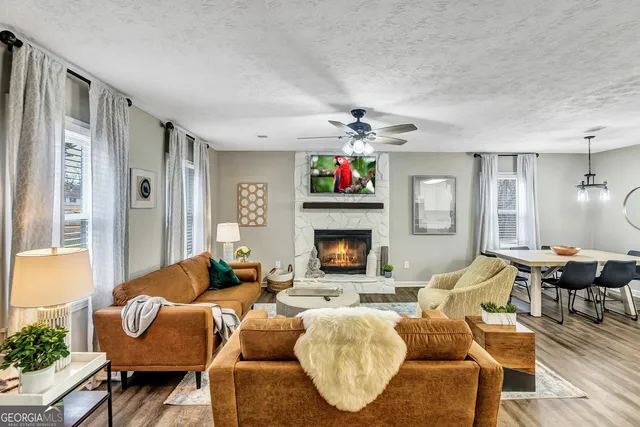 a living room with furniture and a fireplace