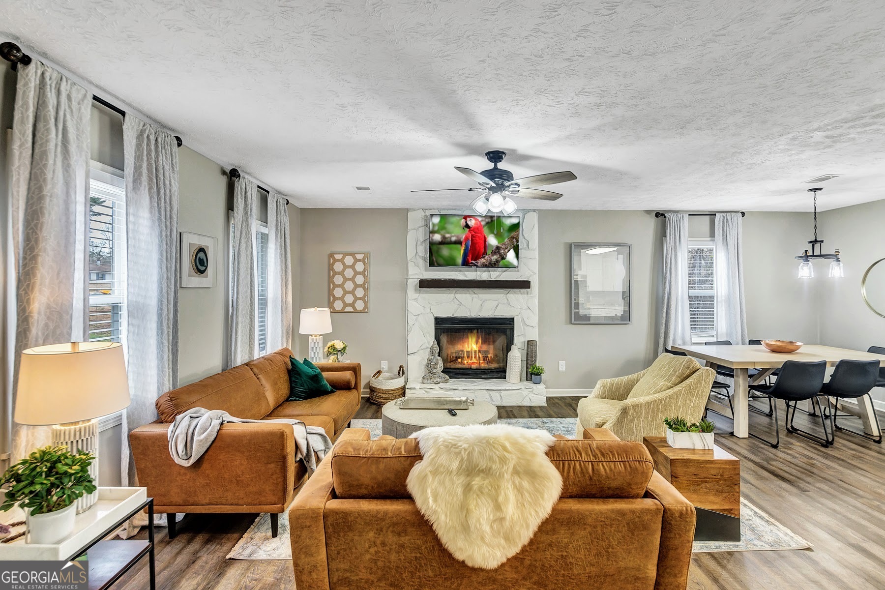 a living room with furniture and a fireplace