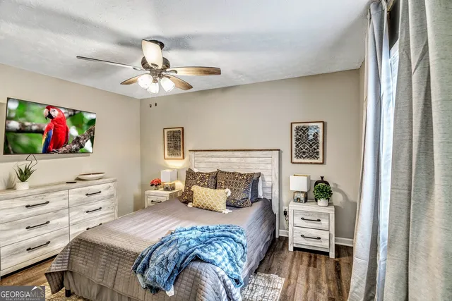 a bedroom with a bed and a dresser