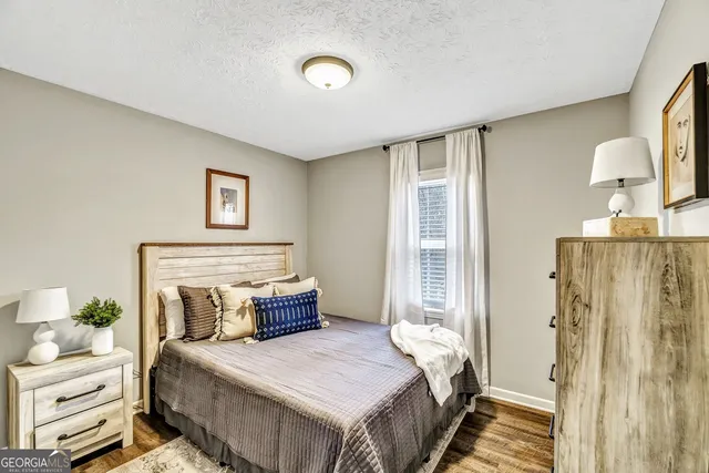 a bedroom with a bed and a table