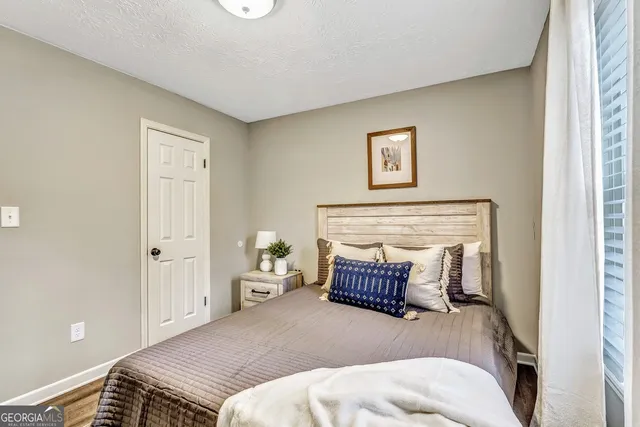 a bedroom with a bed and couch