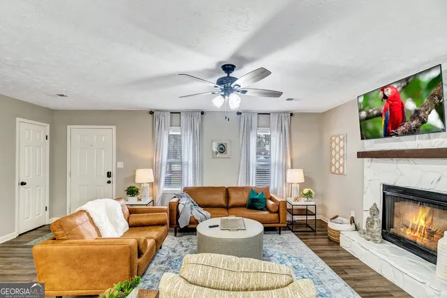 a living room with furniture and a fireplace