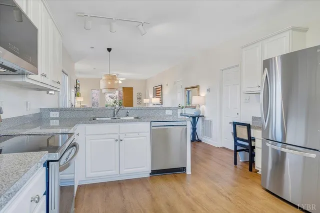 an aerial view of a house with a lake view