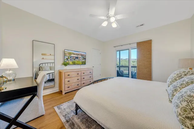 an aerial view of a house with swimming pool patio and lake view