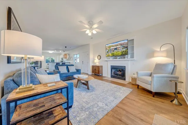 a bedroom with a bed and a ceiling fan