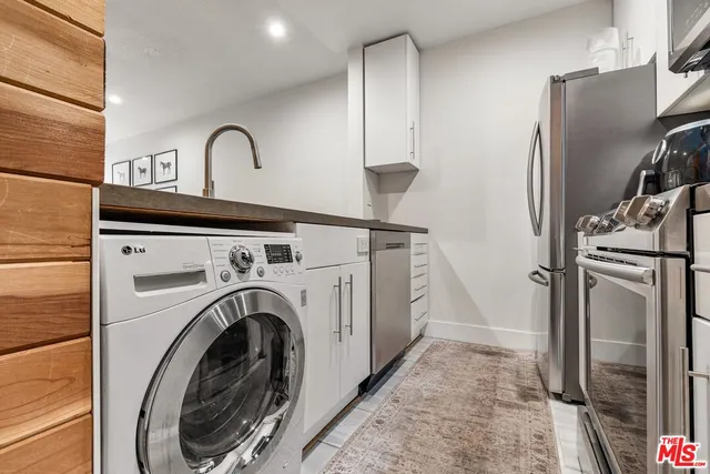 a view of a kitchen with washer and dryer