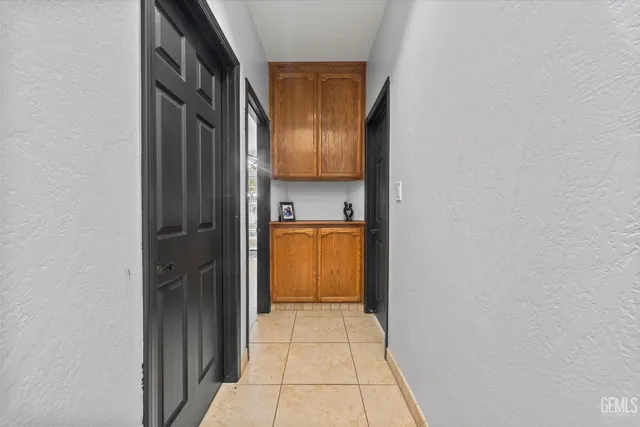 a view of a bathroom from a corridor