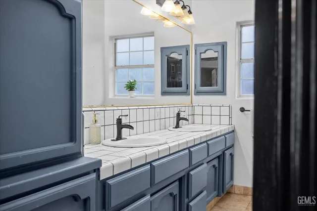 a bathroom with a sink and a mirror