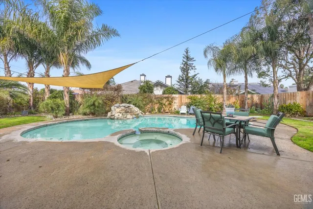 a view of a swimming pool with a patio
