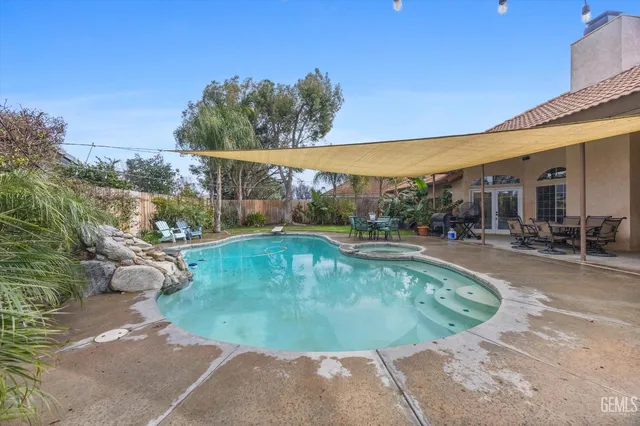 a view of a swimming pool with a patio