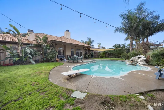 a view of a house with a swimming pool