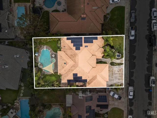 an aerial view of houses with outdoor space
