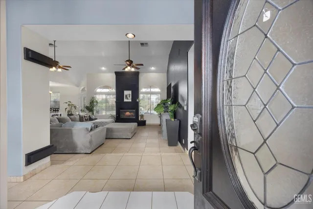 a view of kitchen with furniture and refrigerator