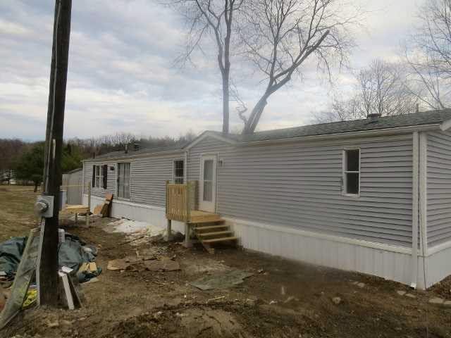 723 Beekman Road, Unit 14 Hopewell Junction, NY 12533 - Photo 1 of 1 a view of a house with backyard and trees