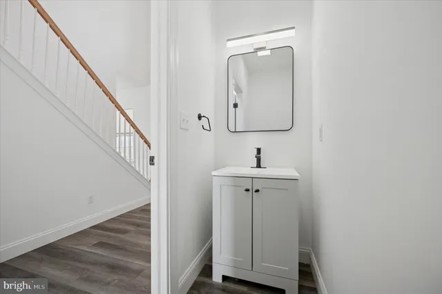a bathroom with a sink and mirror