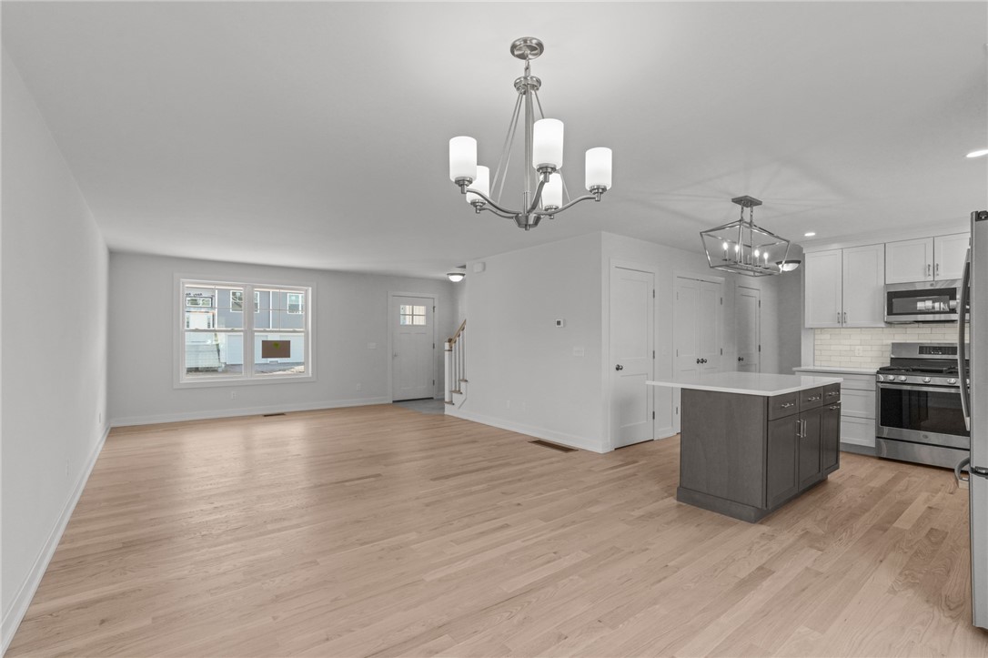 5 Red Maple Lane Warwick, RI 02886 - Photo 11 of 35 A view from the dining area / deck, toward the front of the home