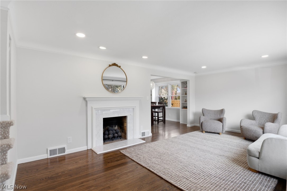 1390 Brainard Road Lyndhurst, OH 44124 - Photo 3 of 33 Living room featuring dark wood-style flooring, recessed lighting, a high end fireplace, and crown molding