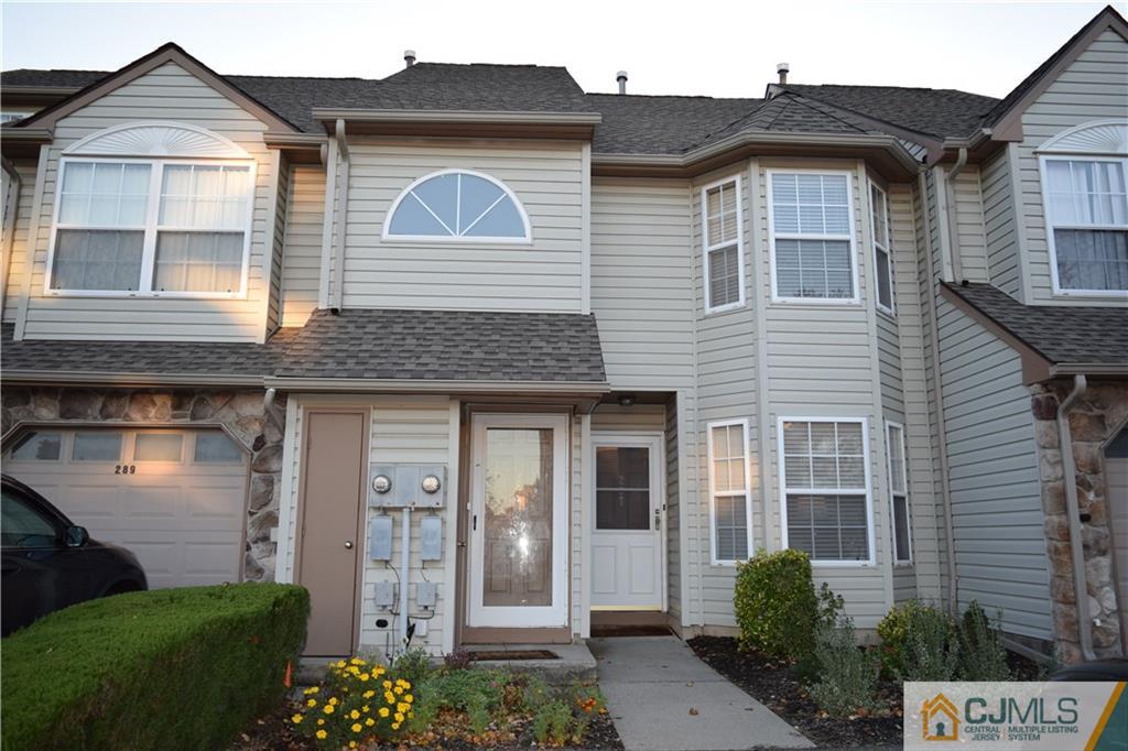 287 Nebula Road, Unit 287 Piscataway, NJ 08854 - Photo 1 of 16 a front view of a house with a garden
