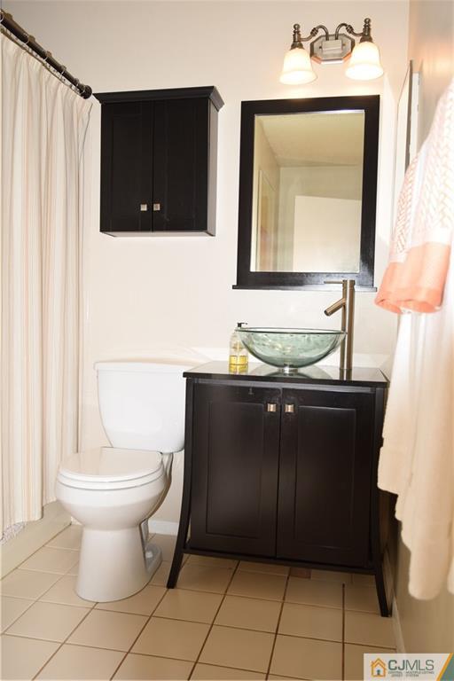 287 Nebula Road, Unit 287 Piscataway, NJ 08854 - Photo 15 of 16 a bathroom with a sink and a toilet