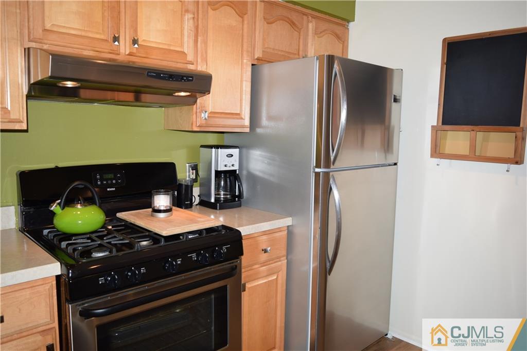 287 Nebula Road, Unit 287 Piscataway, NJ 08854 - Photo 8 of 16 a kitchen with stainless steel appliances granite countertop a stove a refrigerator and a refrigerator