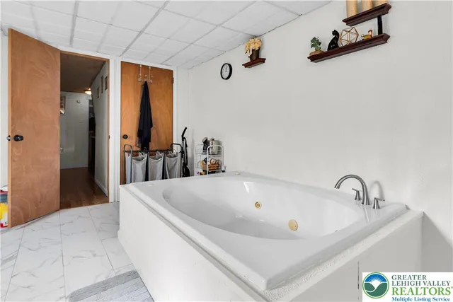 a bathroom with a tub and sink