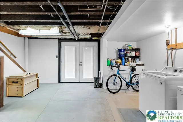 a view of storage and utility room with washer and dryer