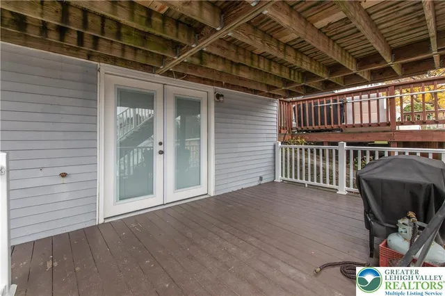 a view of a deck with wooden floor and fence