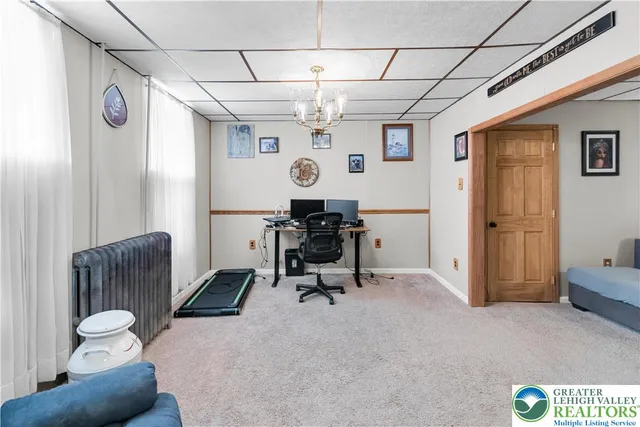 a view of a livingroom with furniture and a window