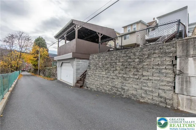 a view of a house with a street