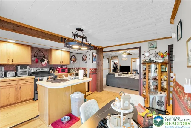 a kitchen with stainless steel appliances kitchen island granite countertop a sink and cabinets