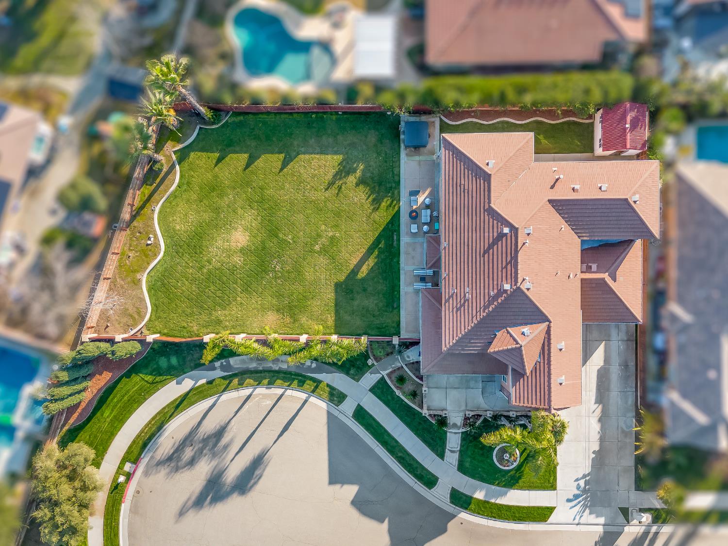 1152 Lester Avenue Clovis, CA 93619 - Photo 26 of 68 an aerial view of a house with a garden and swimming pool