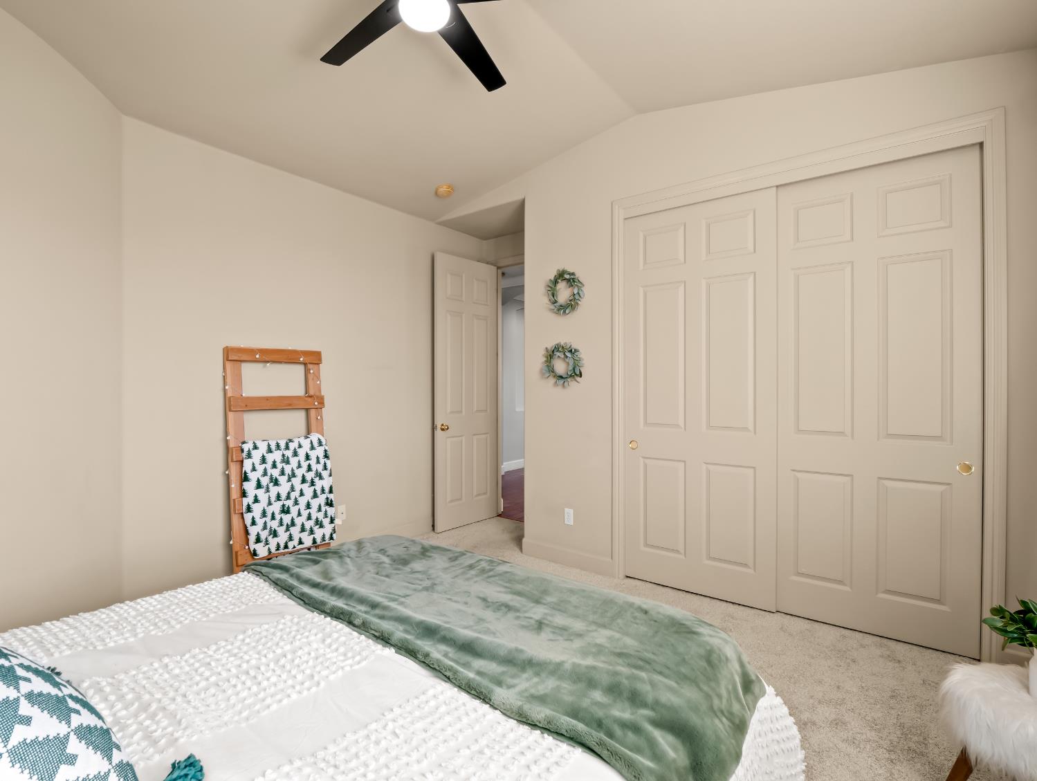 1152 Lester Avenue Clovis, CA 93619 - Photo 66 of 68 a bedroom with a bed and a chandelier