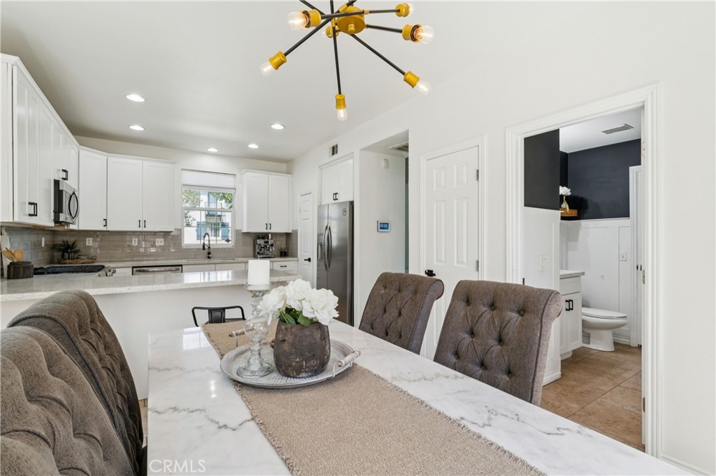 4155 Windspring Street Corona, CA 92883 - Photo 13 of 38 a living room with furniture and a view of kitchen
