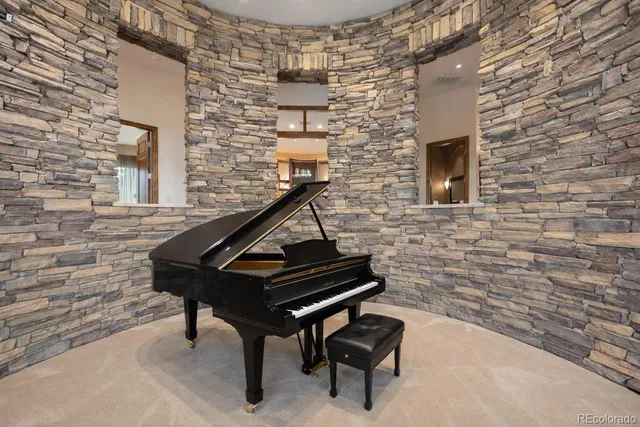 a view of swimming pool with chairs in front of it