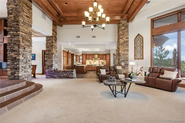 a kitchen with a stove a sink a counter top space and cabinets