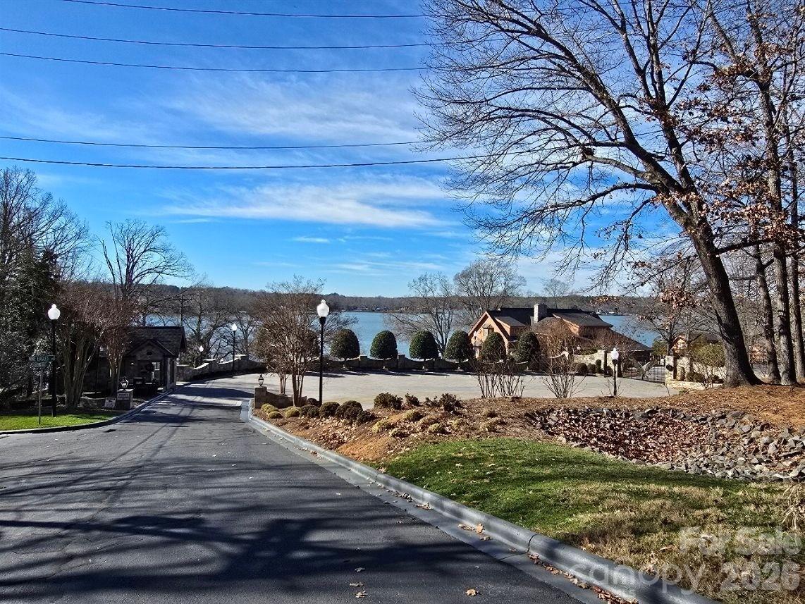 10824 Wildlife Road Charlotte, NC 28278 - Photo 5 of 6 a view of a lake with a yard